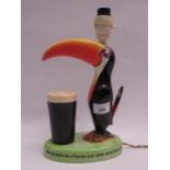 Carlton ware Guinness toucan advertising lamp, 23cm high Light does not work, would need re-wiring