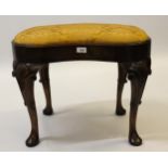 19th Century walnut kidney shaped stool in George II style, the drop-in seat above a moulded