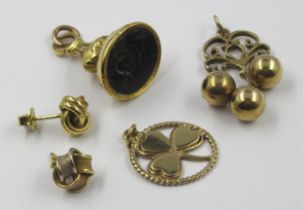 9ct Gold fob seal, 9ct gold pendant, two 18ct gold stud earrings and a 9ct gold clover leaf pendant