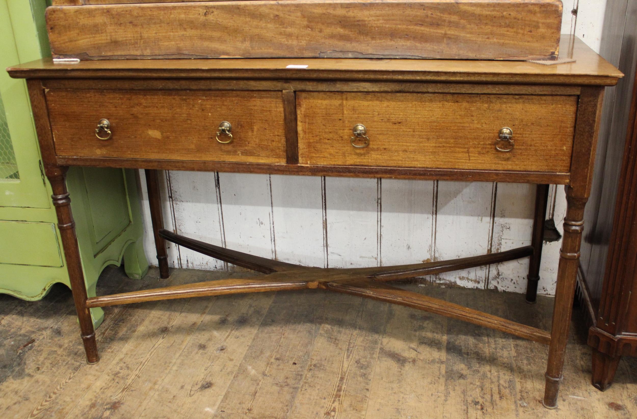 20th Century mahogany two drawer side table, having brass drop handles with crossover stretcher ,