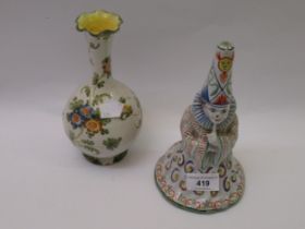 French pottery hand bell in the form of a wizard, together with an Italian pottery baluster form