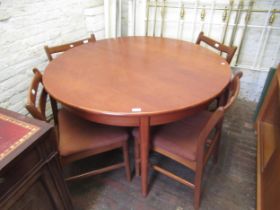 Mid 20th Century teak dining room suite comprising: circular extending dining table with integral