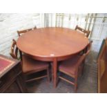 Mid 20th Century teak dining room suite comprising: circular extending dining table with integral