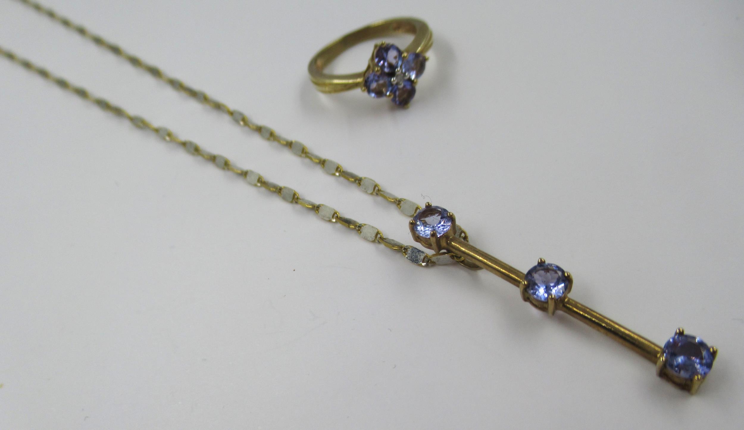 9ct Gold dress ring set four tanzanites, size J, together with a similar tanzanite set pendant