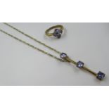 9ct Gold dress ring set four tanzanites, size J, together with a similar tanzanite set pendant