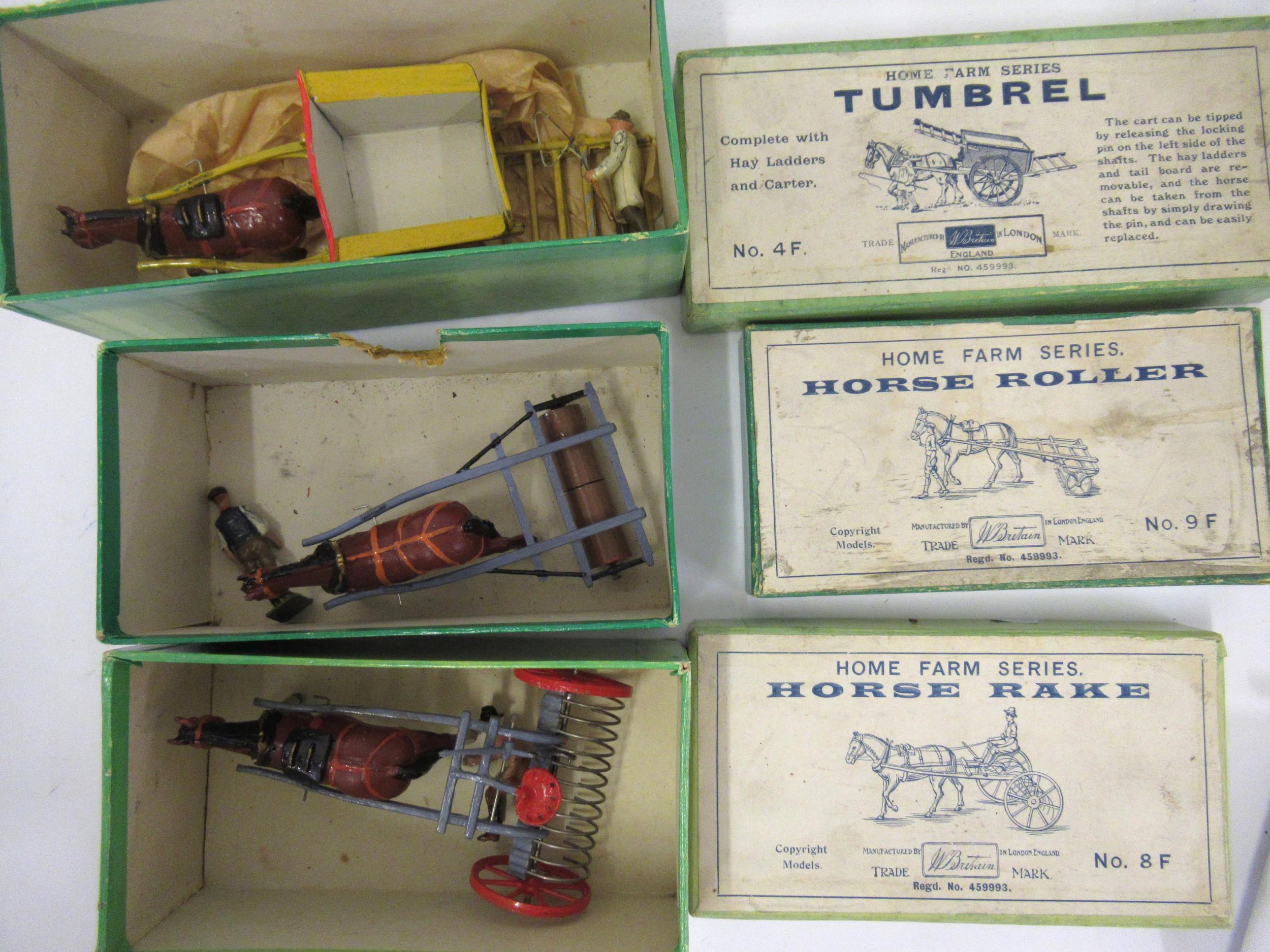 Three Britains Home Farm series boxed toys, horse rake No. 8F, tumbrel No. 4F and horse roller No.