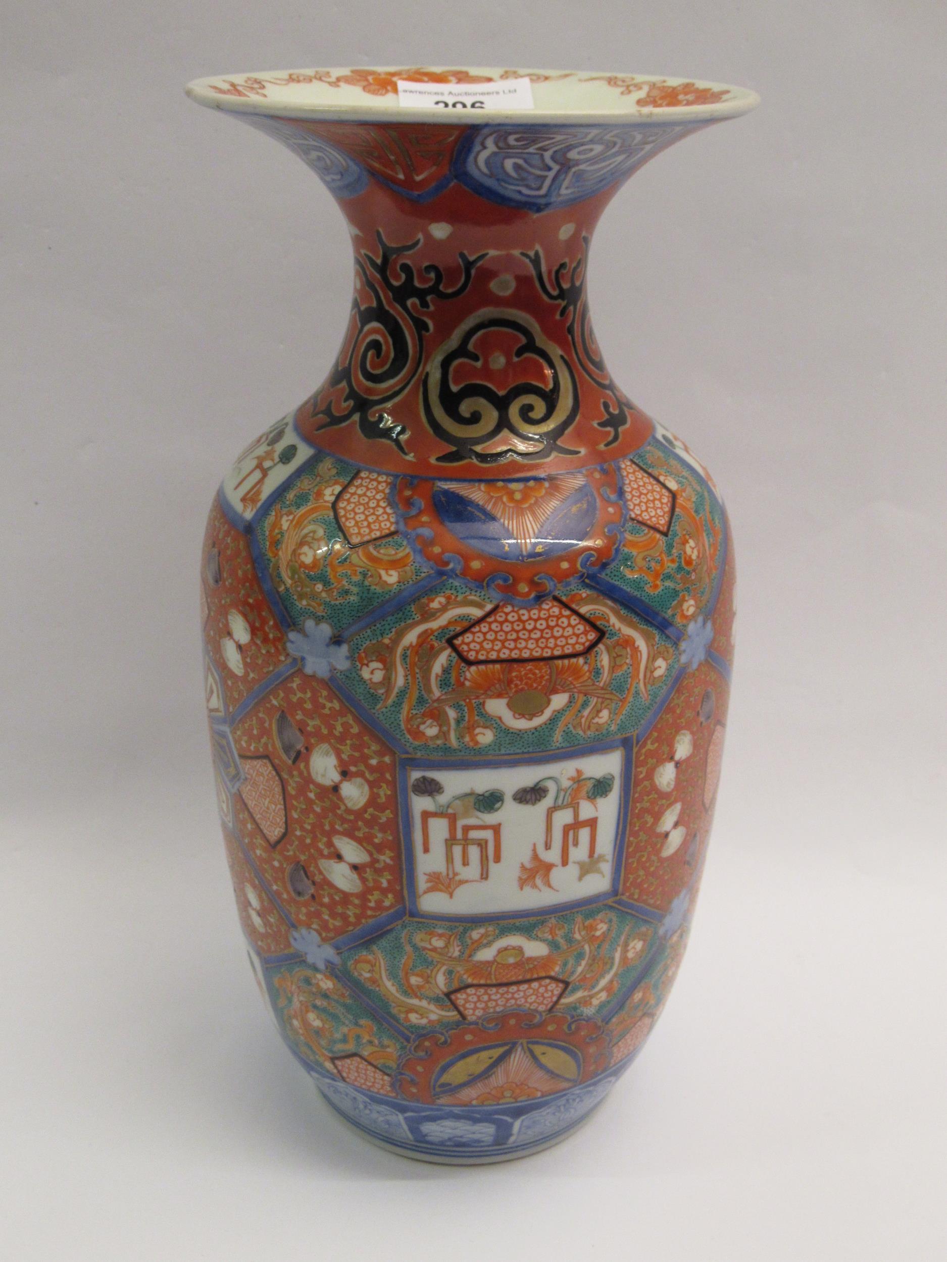 Imari vase with flared rim and baluster body decorated with an all-over design in shades of iron