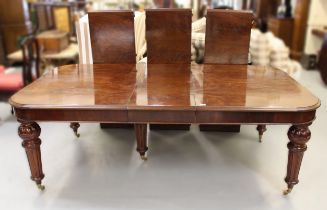 Large reproduction mahogany pull-out extending dining table in Victorian style, the moulded top