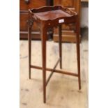 Reproduction mahogany kettle stand with shaped galleried top, together with a similar reproduction