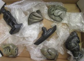 Group of seven various Inuit stone and composite carvings including Aardvark and Ammon