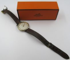 Hermes, ladies circular wristwatch with a brown leather strap, in a Hermes box