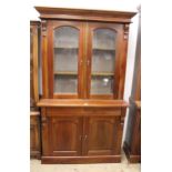 Reproduction mahogany bookcase, the moulded top above two arched top glazed doors, two frieze