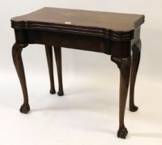 Mid 18th Century mahogany games / tea table with a triple fold-over top, raised on shell carved
