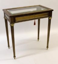 19th Century French mahogany and brass mounted bijouterie table with a hinged bevelled glass lid,