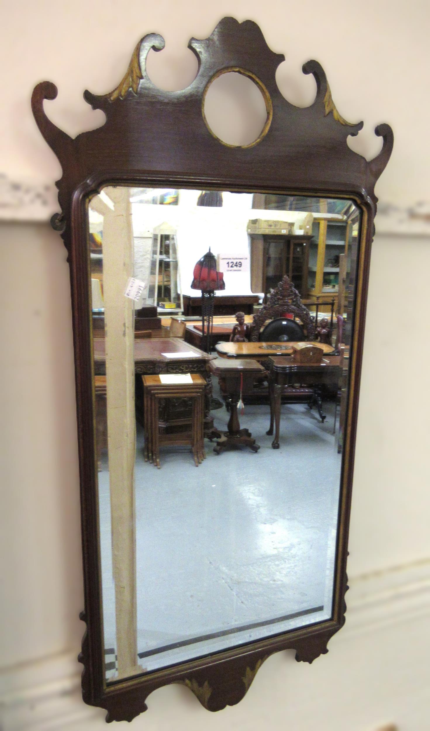 19th Century mahogany and parcel gilt wall mirror with fretwork mounts and bevelled plate, 89 x 44cm