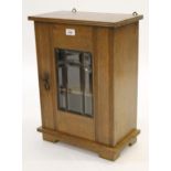 Early 20th Century oak wall cabinet, the single door with bevelled glass panels Good Condition needs