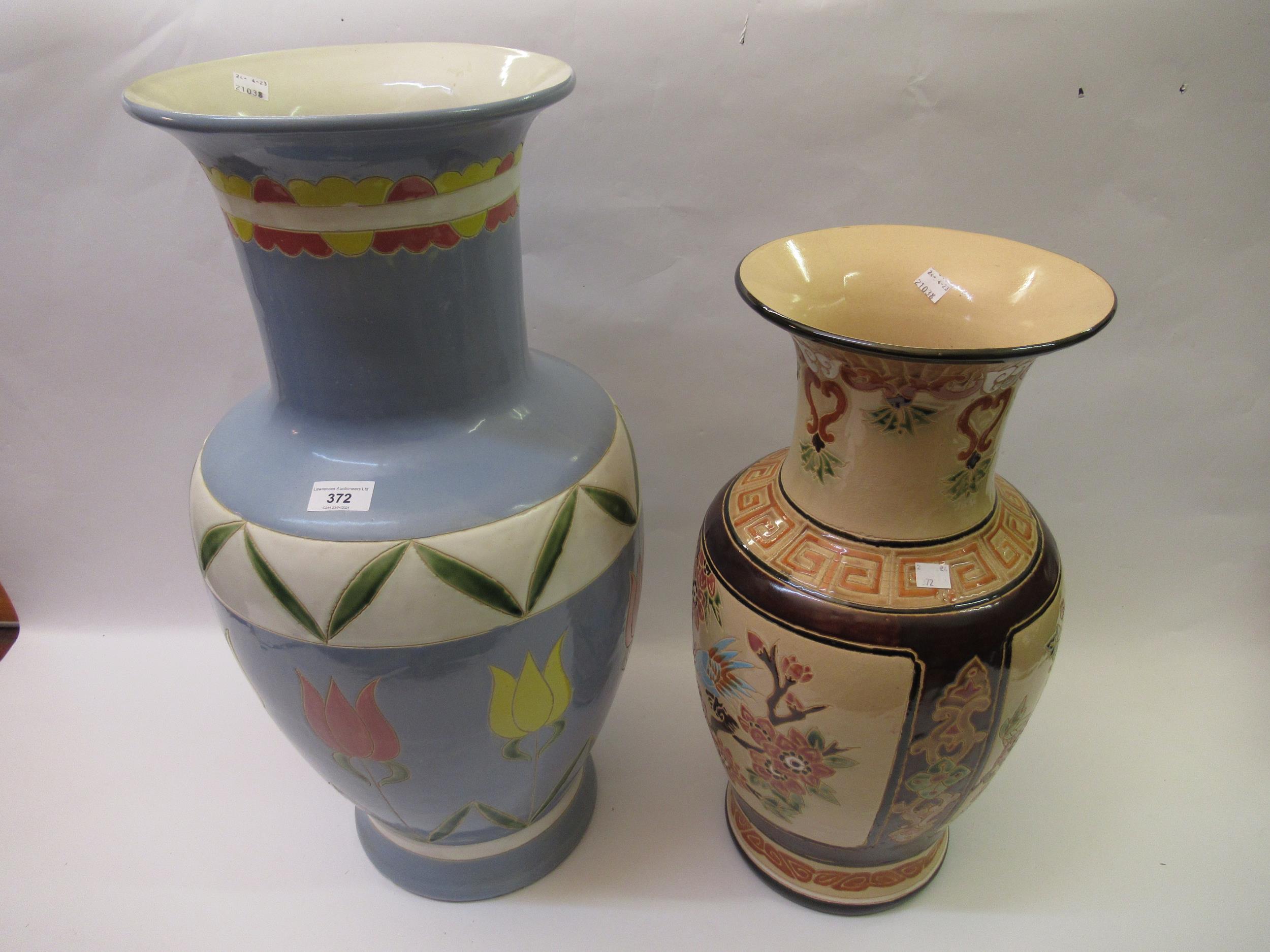 Two large modern oriental pottery vases, the tallest 66ins