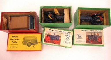 Two Britains model farm Fordson Major tractors in original boxes, together with a Britains clockwork