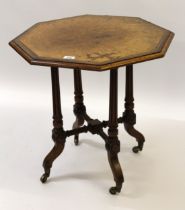 Small figured walnut octagonal occasional table on four tapering fluted supports with crossover