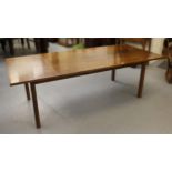 Gordon Russell Limited, walnut rectangular dining table with integral single leaf on square