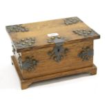 Arts and Crafts oak and metal mounted jewel box, the hinged lid enclosing a fitted interior with