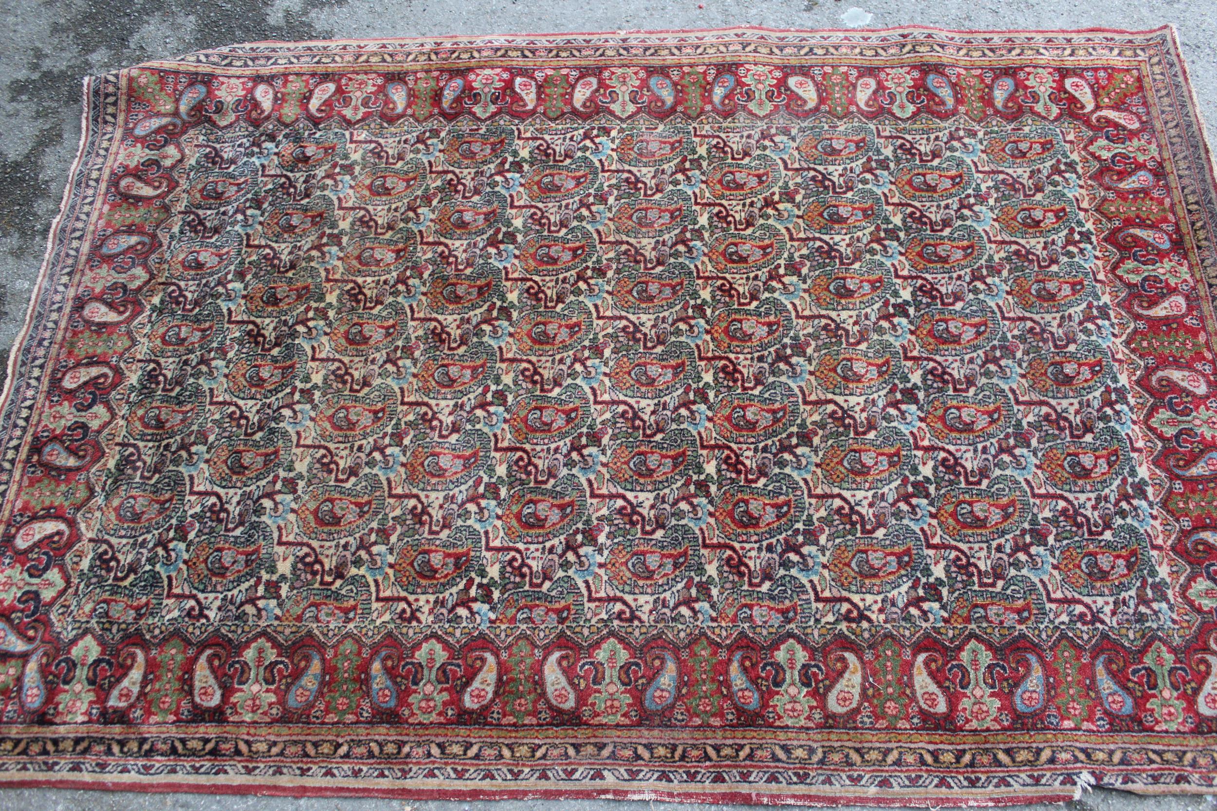 Tabriz rug with all-over Boteh design on a cream ground with borders, 180 x 122cm (damages)