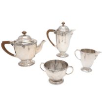 AN EARLY 20TH CENTURY FOUR-PIECE SILVER TEA SET.