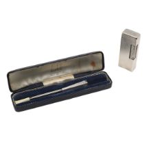 A 20TH CENTURY SILVER DUNHILL LIGHTER.