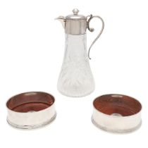 A PAIR OF MODERN SILVER MOUNTED WOODEN WINE COASTERS.