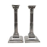 A PAIR OF VICTORIAN SILVER CANDLESTICKS.