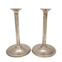 A PAIR OF MODERN SILVER CANDLESTICKS, BY THEO FENNELL.