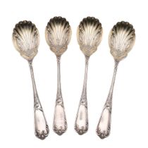 A CASED SET OF FOUR LATE VICTORIAN SILVER FRUIT SERVING SPOONS.