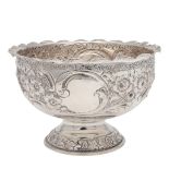 A LATE VICTORIAN EMBOSSED SILVER ROSE BOWL.