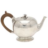 A VICTORIAN SILVER "BULLET" TEA POT.