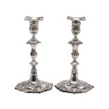 A PAIR OF GEORGE IV CAST SILVER CANDLESTICKS, BY ROBERT GARRARD.