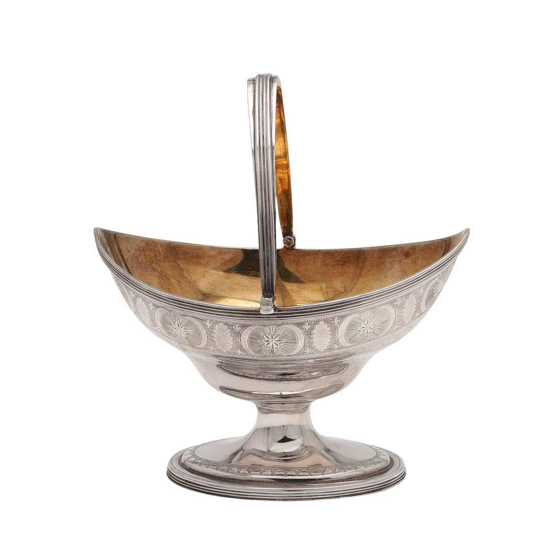 A GEORGE III SILVER SWING-HANDLED SUGAR BASKET.