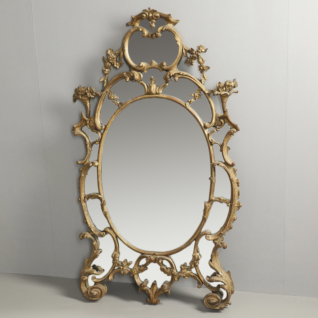 A LATE 18TH CENTURY GILTWOOD SECTIONAL WALL MIRROR.
