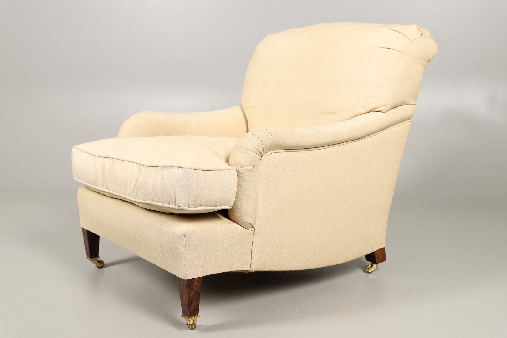 A HOWARD-STYLE DEEP SEATED ARMCHAIR. - Image 4 of 6