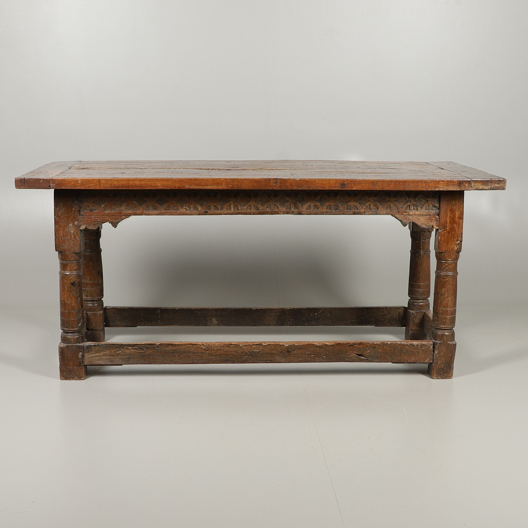 A 17TH CENTURY AND LATER OAK REFECTORY TABLE.