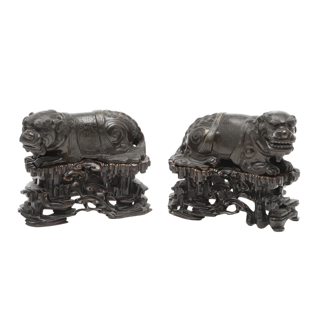 PAIR OF CHINESE BRONZE DOGS OF FO & CARVED WOODEN STANDS.