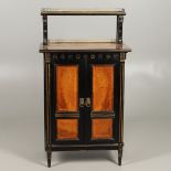 A LATE VICTORIAN AMBOYNA AND EBONISED MUSIC CABINET.