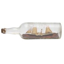 A FOLK ART PADDLE STEAMER IN BOTTLE.