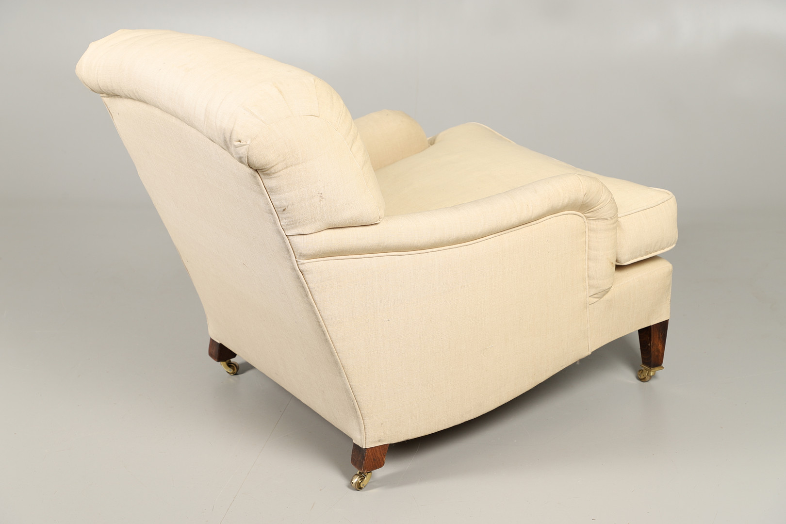 A HOWARD-STYLE DEEP SEATED ARMCHAIR. - Image 6 of 6