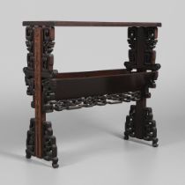 AN EARLY 20TH CENTURY CHINESE HARDWOOD BOOK TROUGH.