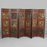 A CHINESE CARVED AND LACQUERED SIX FOLD SCREEN.