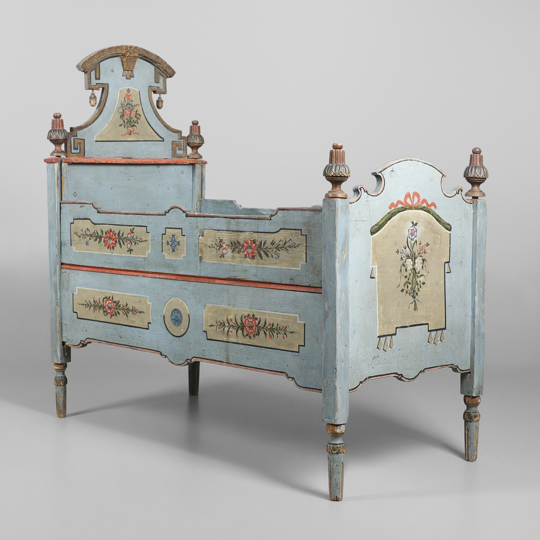 AN UNUSUAL SWEDISH PAINTED PINE FOLK ART COT, CIRCA 1800.