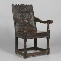 A 17TH CENTURY OAK WAINSCOTT CHAIR.