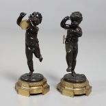 A PAIR OF FRENCH BRONZE PUTTI, IN THE MANNER OF CLAUDE 'CLODION' MICHEL.