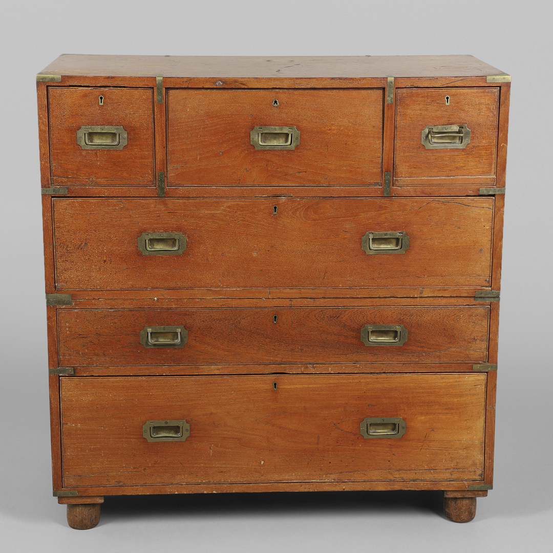 A 19TH CENTURY TEAK CAMPAIGN CHEST.