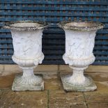 A PAIR OF PAINTED COMPOSITE MARBLE MEDICI STYLE URNS.